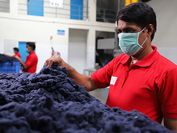 A worker in Sutlej Textile manufacturing facility in Jammu & Kashmir